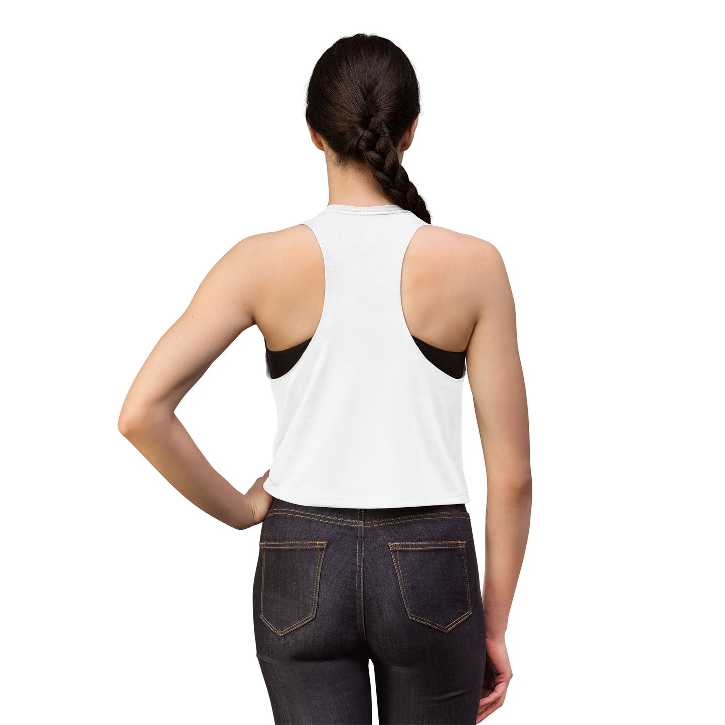 Person wearing a white tank top and dark jeans on a white background