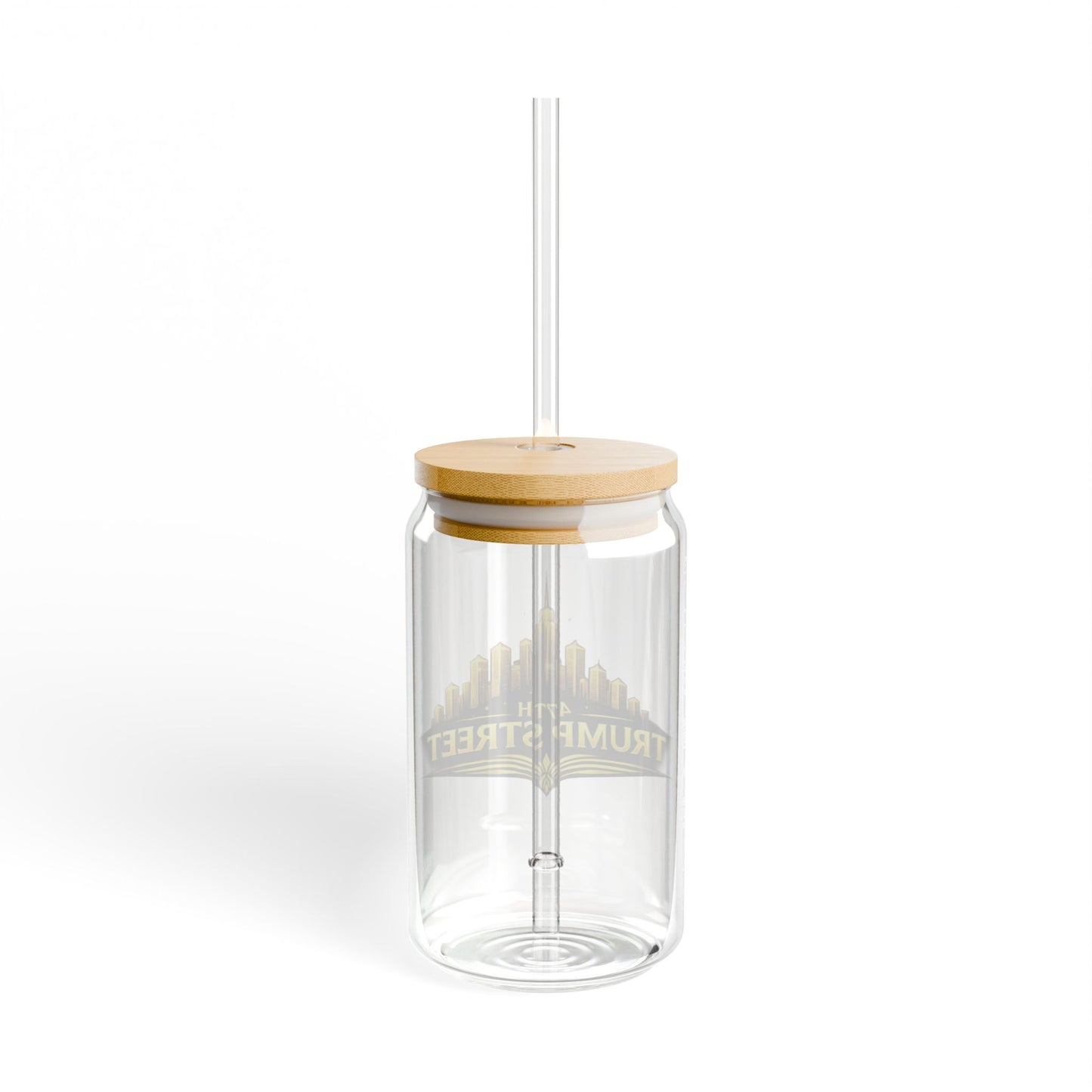 Clear glass tumbler with a wooden lid and straw on a white background