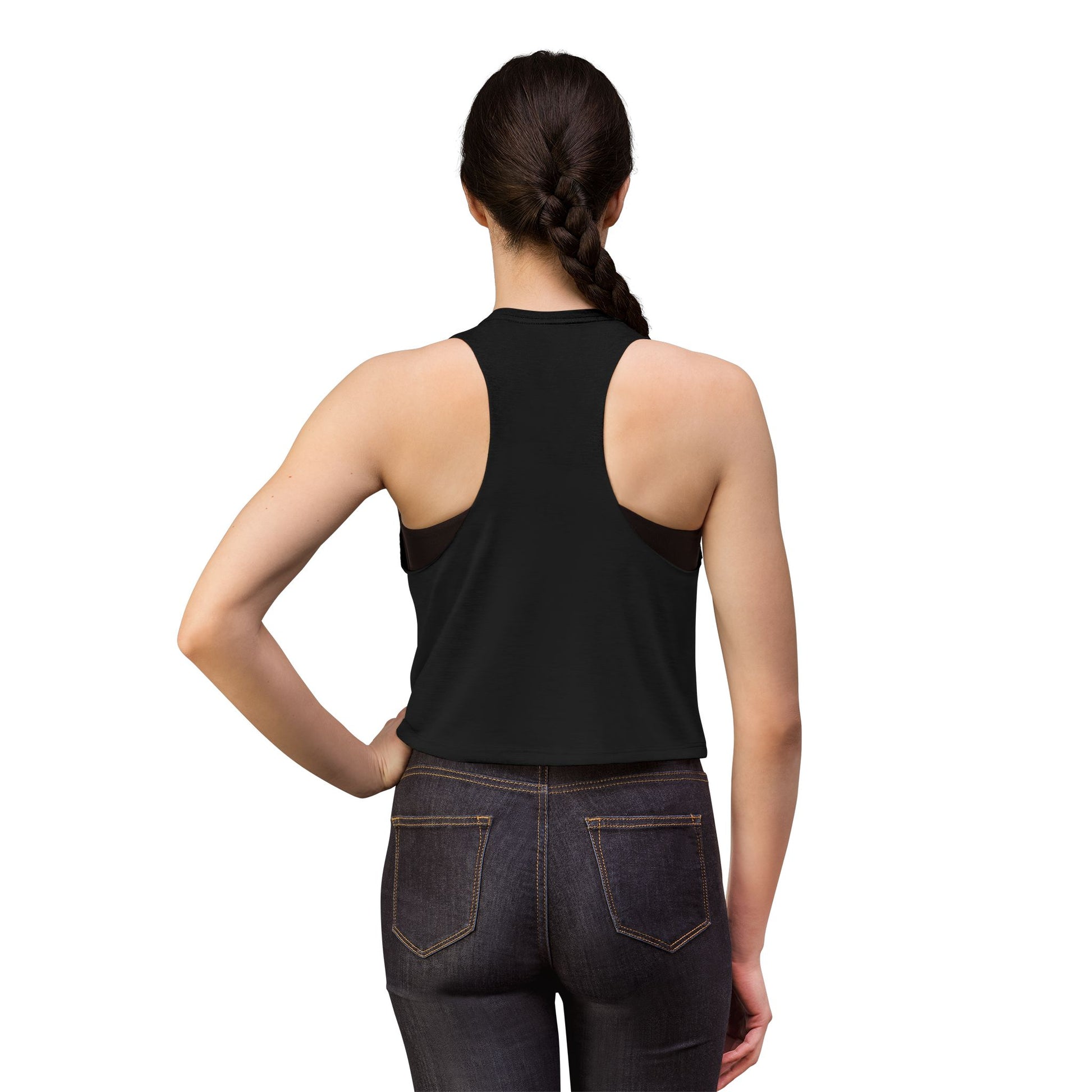 Person wearing a black tank top and dark jeans on a white background