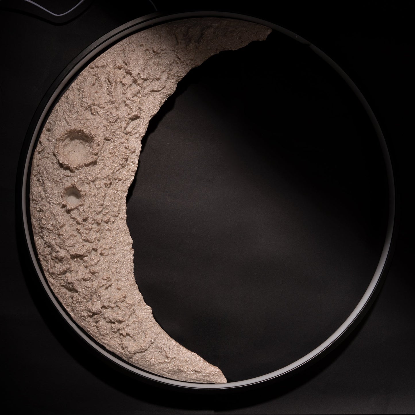 close-up of textured crescent moon LED wall light design