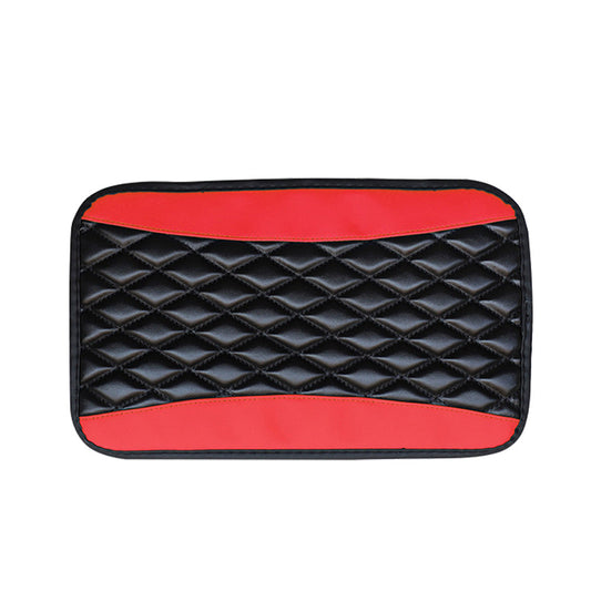 Black quilted mat with red accents on a white background