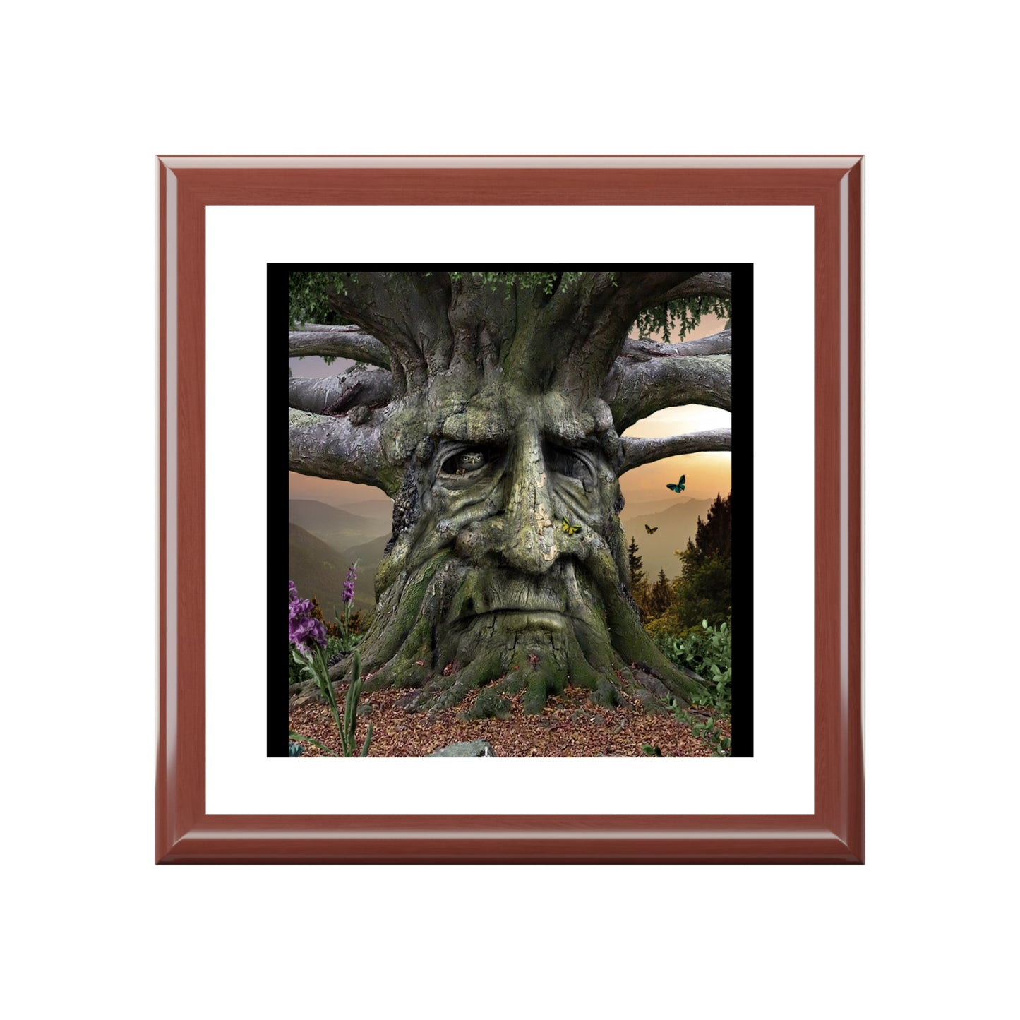 Framed artwork of a tree with a face in a natural setting