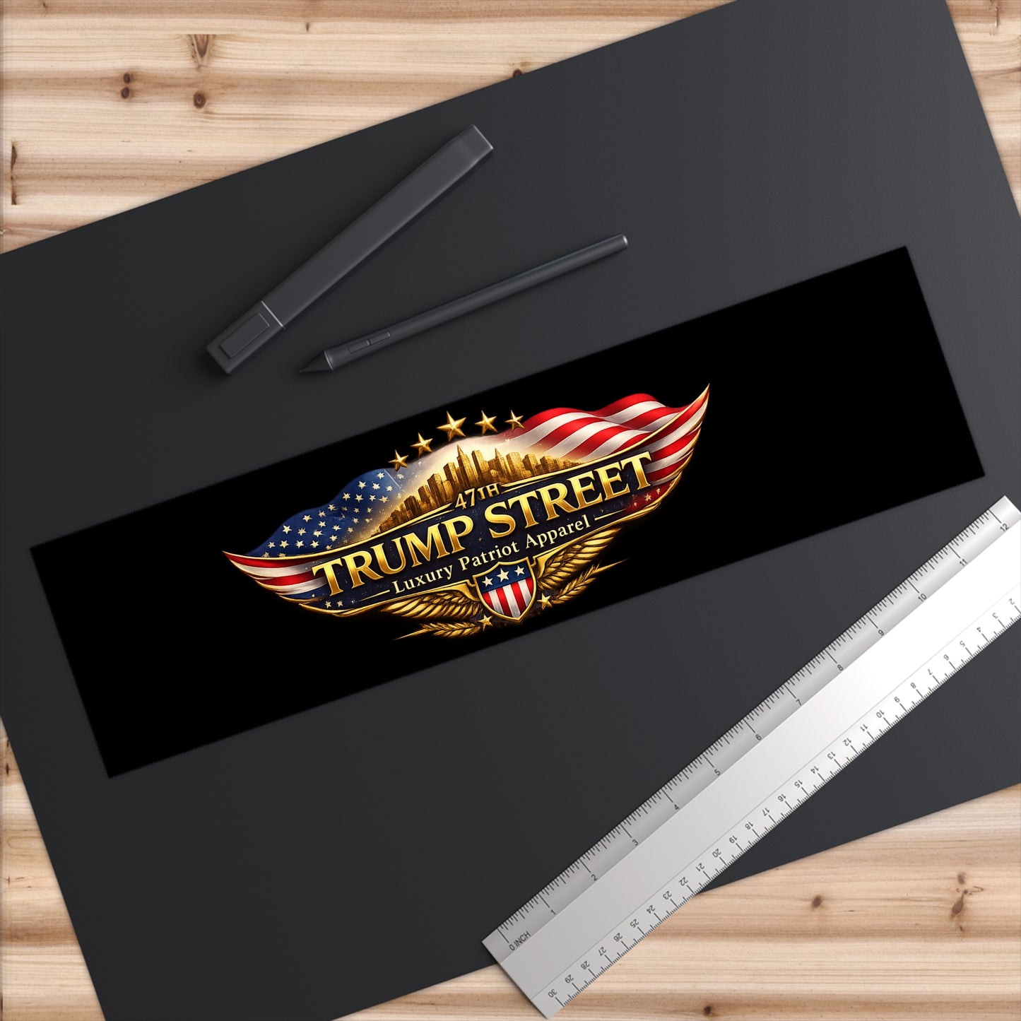 Trump Street logo with American flag design on a black background with ruler and pen.