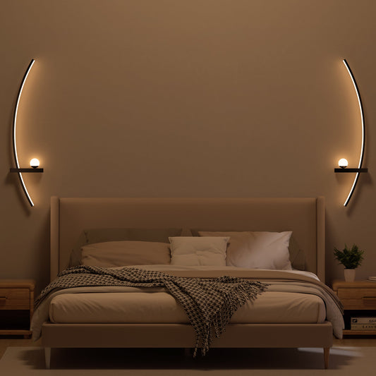 Set of two modern orb arc wall lamps creating soft ambient lighting in a stylish interior