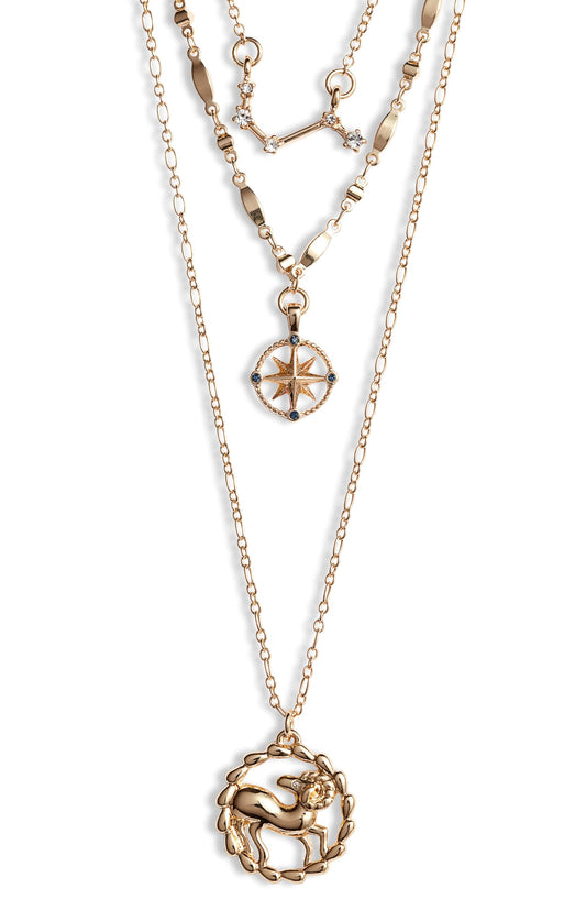Aries zodiac layered charm necklace with gold astrology pendants