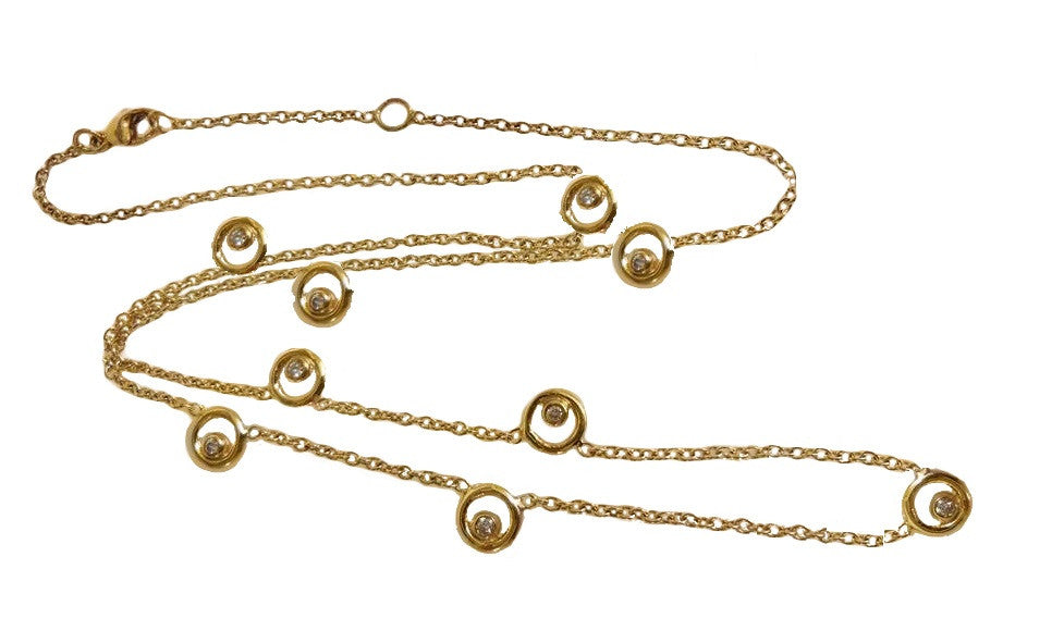 Karma Chain 14K gold ripple diamond necklace close up symbolizing connection and energy