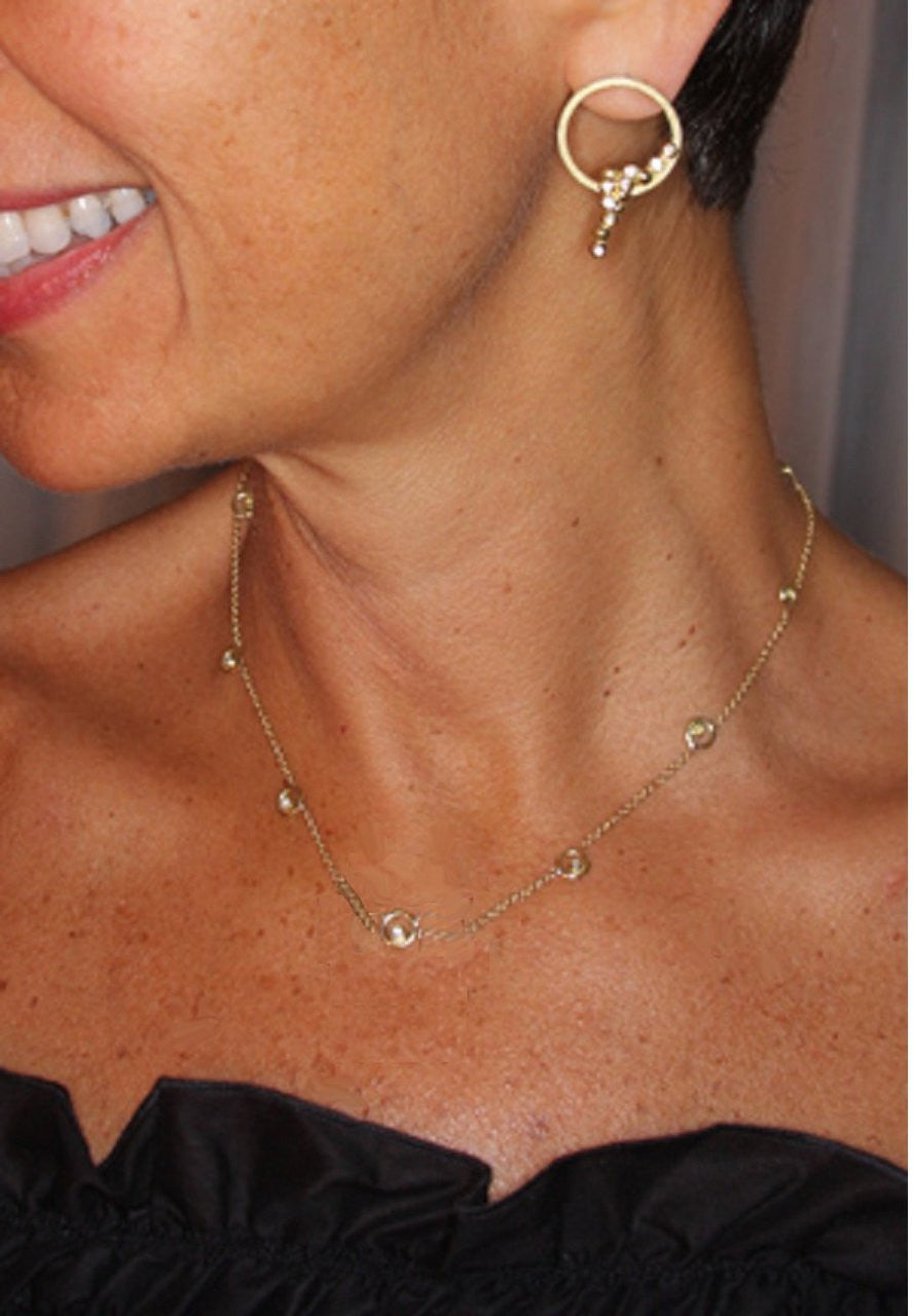 Karma Chain 14K gold ripple diamond necklace symbolizing connection and energy worn on a model