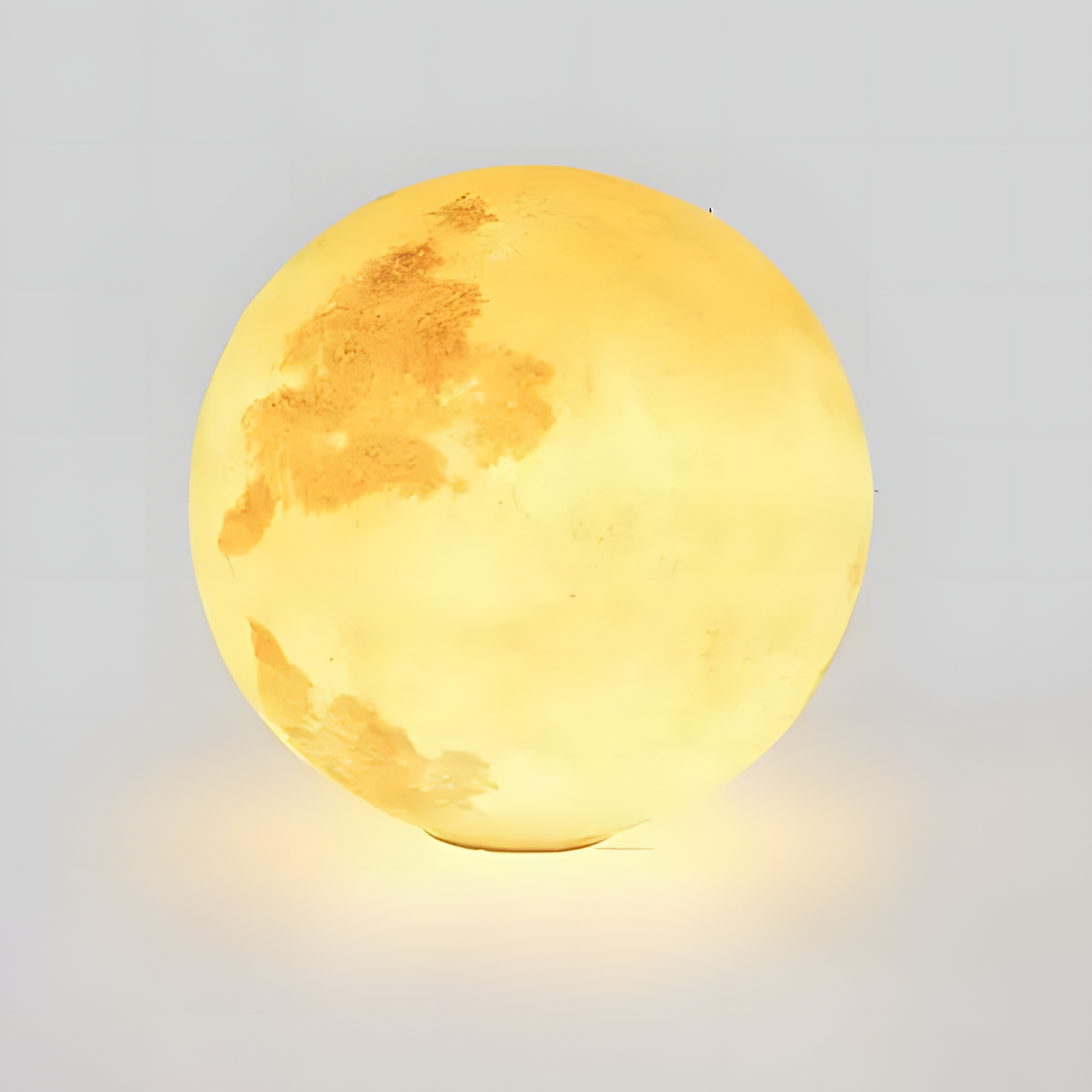 Moon-shaped lamp on a light gray background