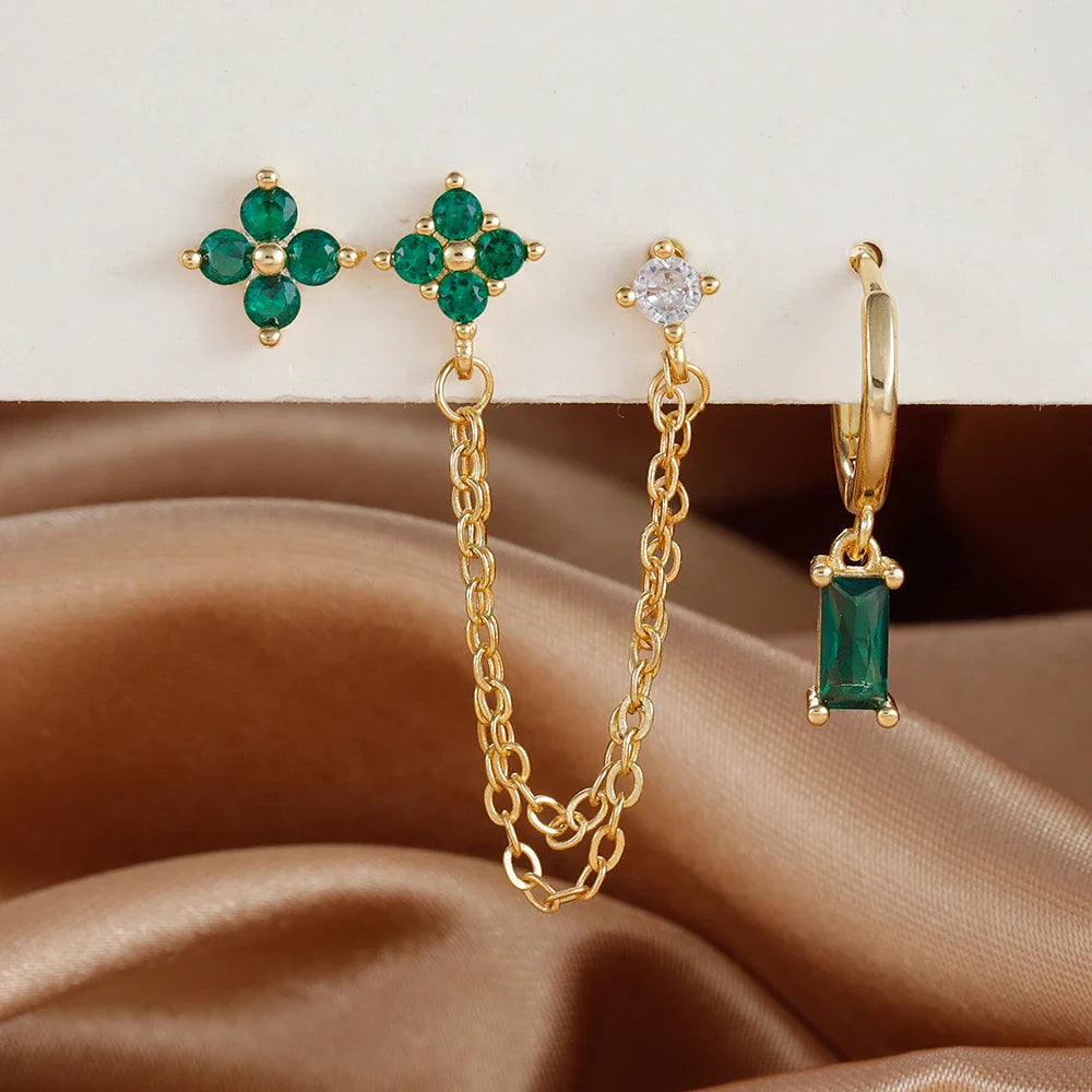 Celestial zodiac birthstone earring set in gold with gemstone accents and elegant chain detail