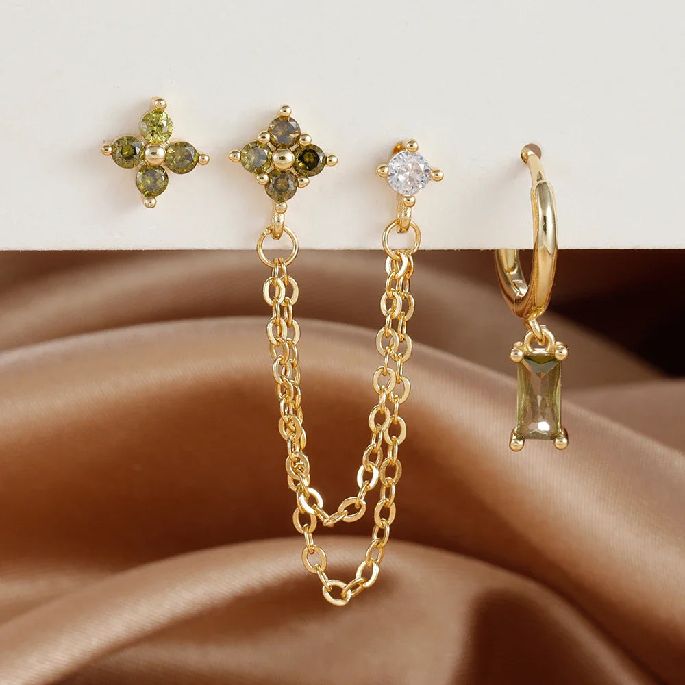 Celestial zodiac birthstone earring set in gold with gemstone accents and elegant chain detail
