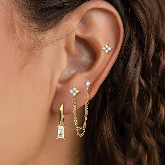 Celestial zodiac birthstone earring set in gold with gemstone accents and elegant chain detail