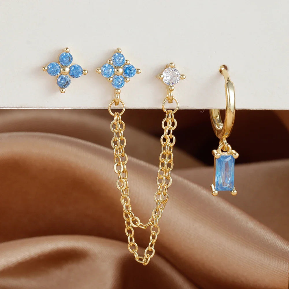 Celestial zodiac birthstone earring set in gold with gemstone accents and elegant chain detail