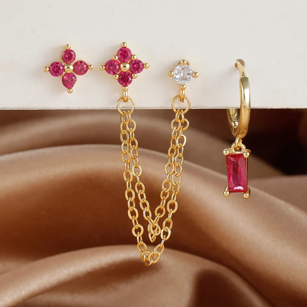 Celestial zodiac birthstone earring set in gold with gemstone accents and elegant chain detail
