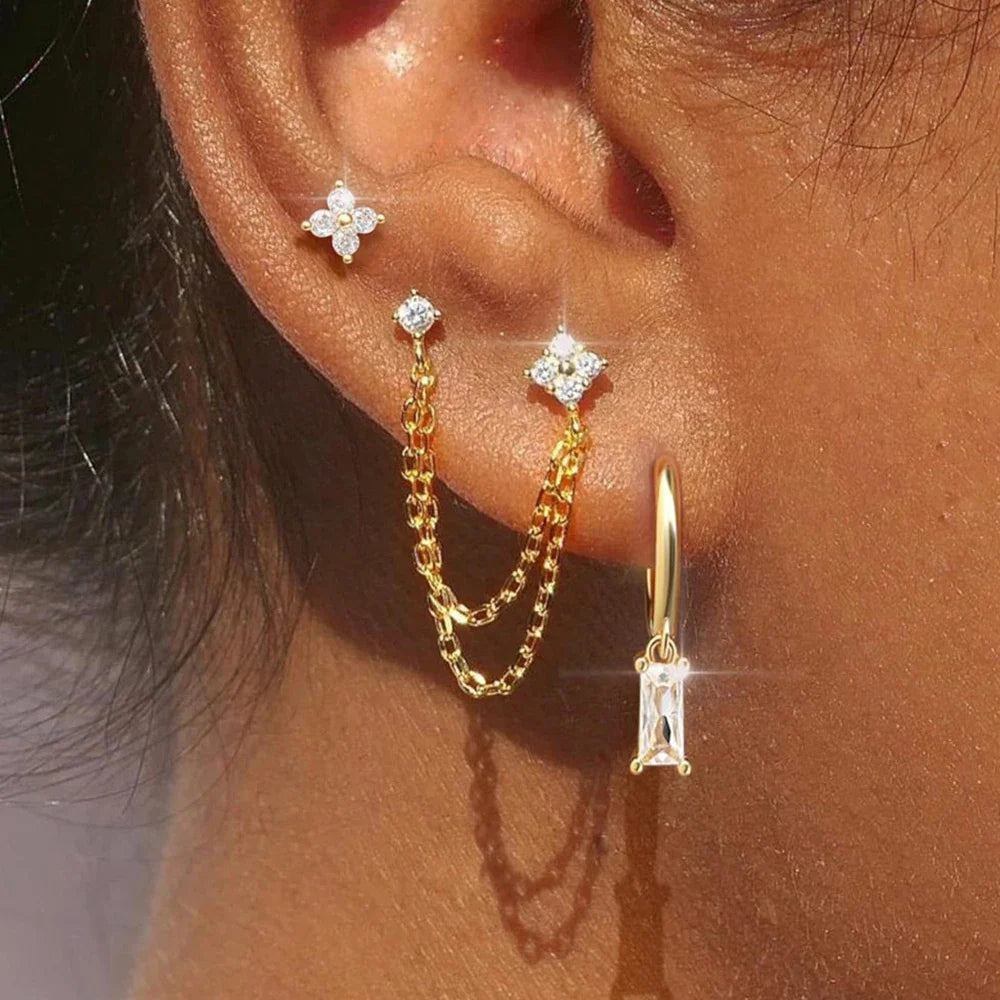 Celestial zodiac birthstone earring set in gold with gemstone accents and elegant chain detail