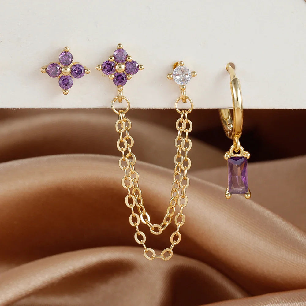 Celestial zodiac birthstone earring set in gold with gemstone accents and elegant chain detail