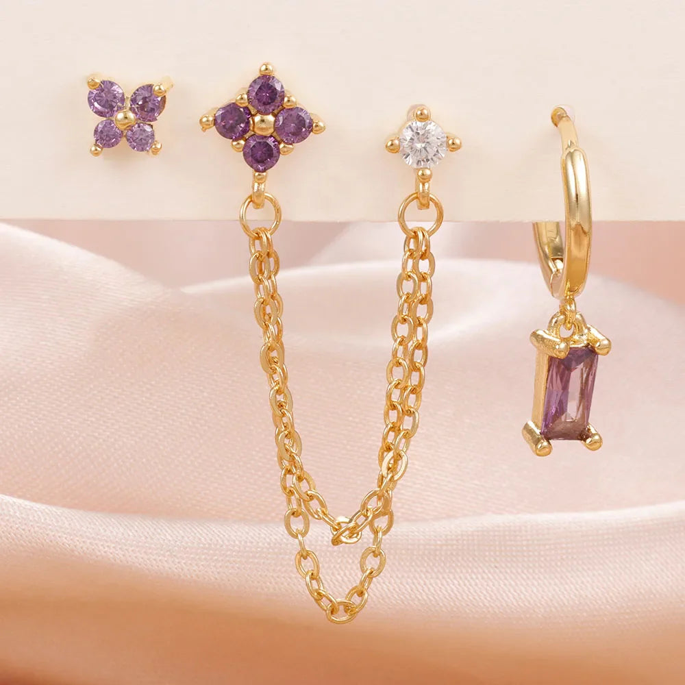 Celestial zodiac birthstone earring set in gold with gemstone accents and elegant chain detail
