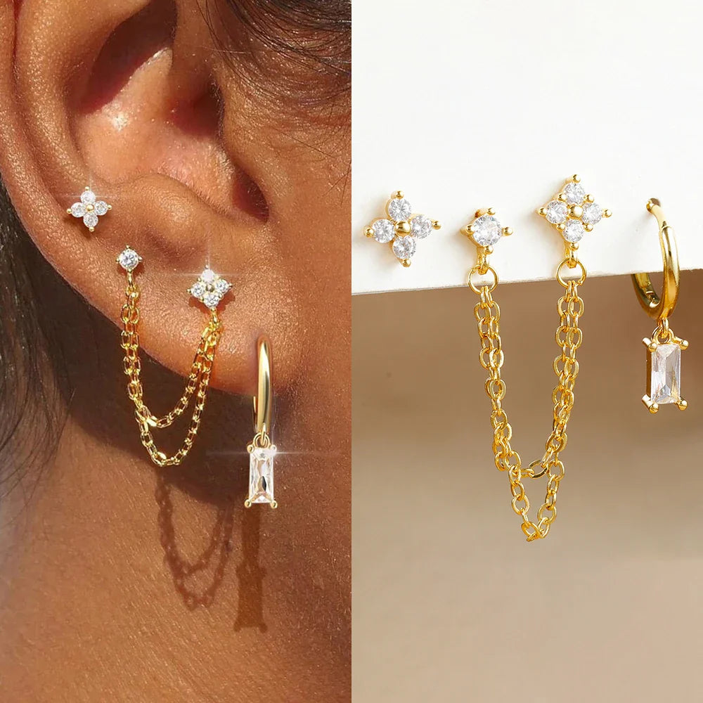 Celestial zodiac birthstone earring set in gold with gemstone accents and elegant chain detail
