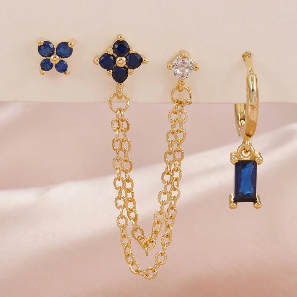 Celestial zodiac birthstone earring set in gold with gemstone accents and elegant chain detail