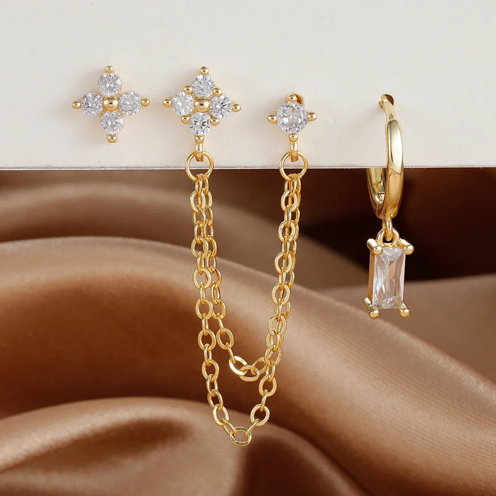 Celestial zodiac birthstone earring set in gold with gemstone accents and elegant chain detail