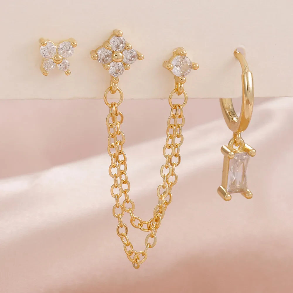 Celestial zodiac birthstone earring set in gold with gemstone accents and elegant chain detail