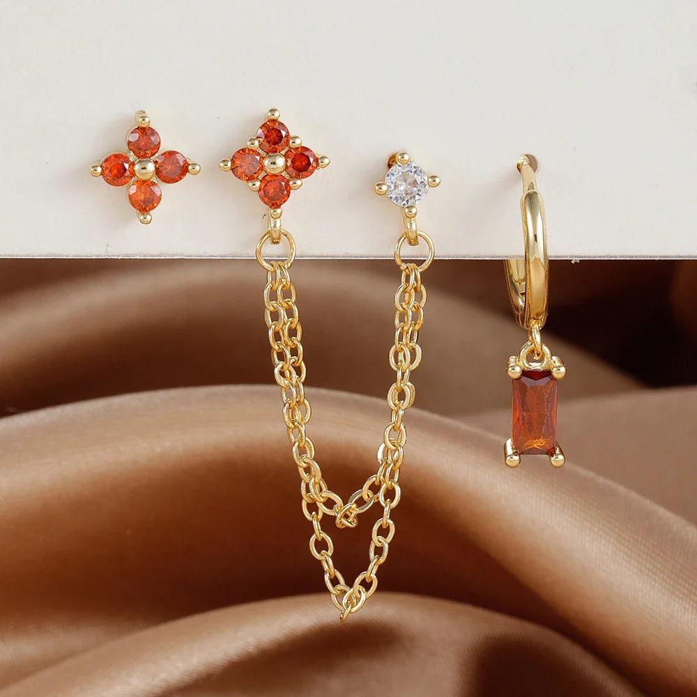 Celestial zodiac birthstone earring set in gold with gemstone accents and elegant chain detail