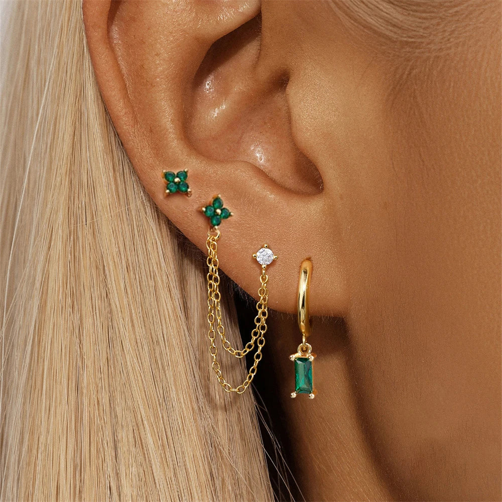 Celestial zodiac birthstone earring set in gold with gemstone accents and elegant chain detail