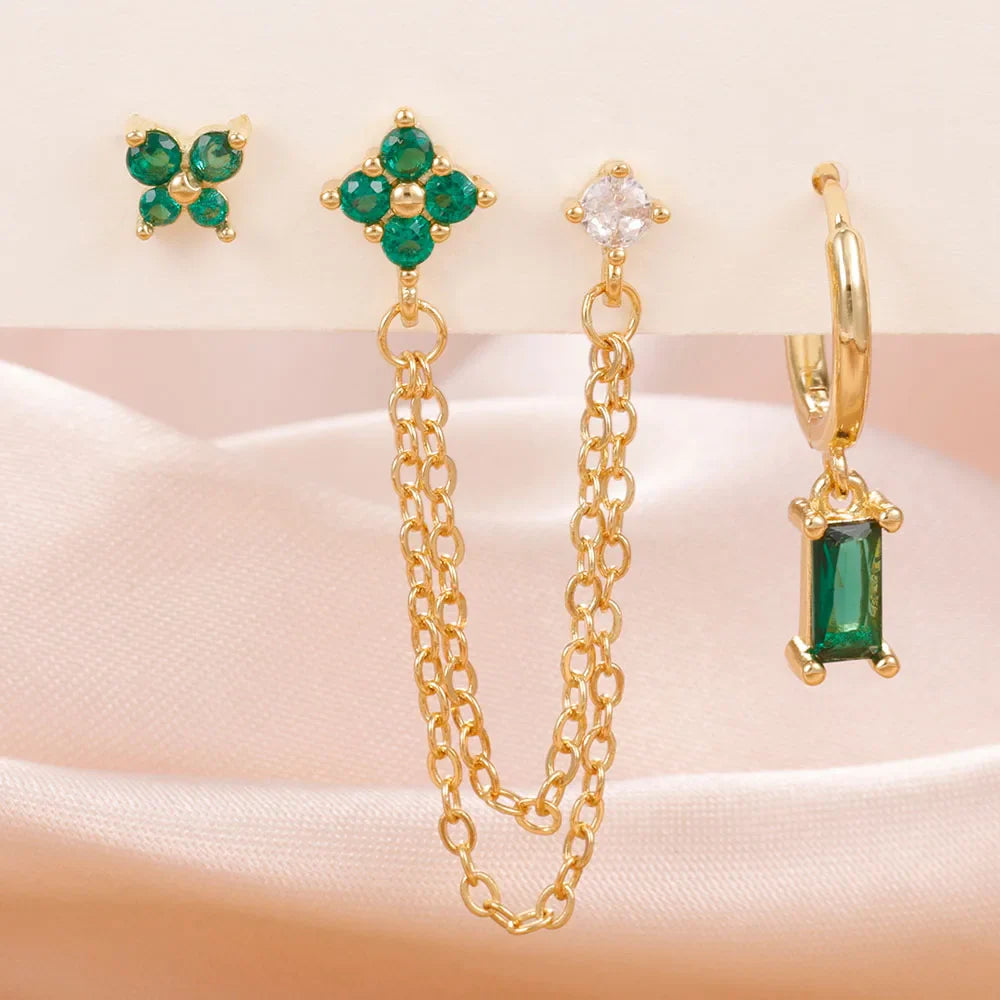 Celestial zodiac birthstone earring set in gold with gemstone accents and elegant chain detail