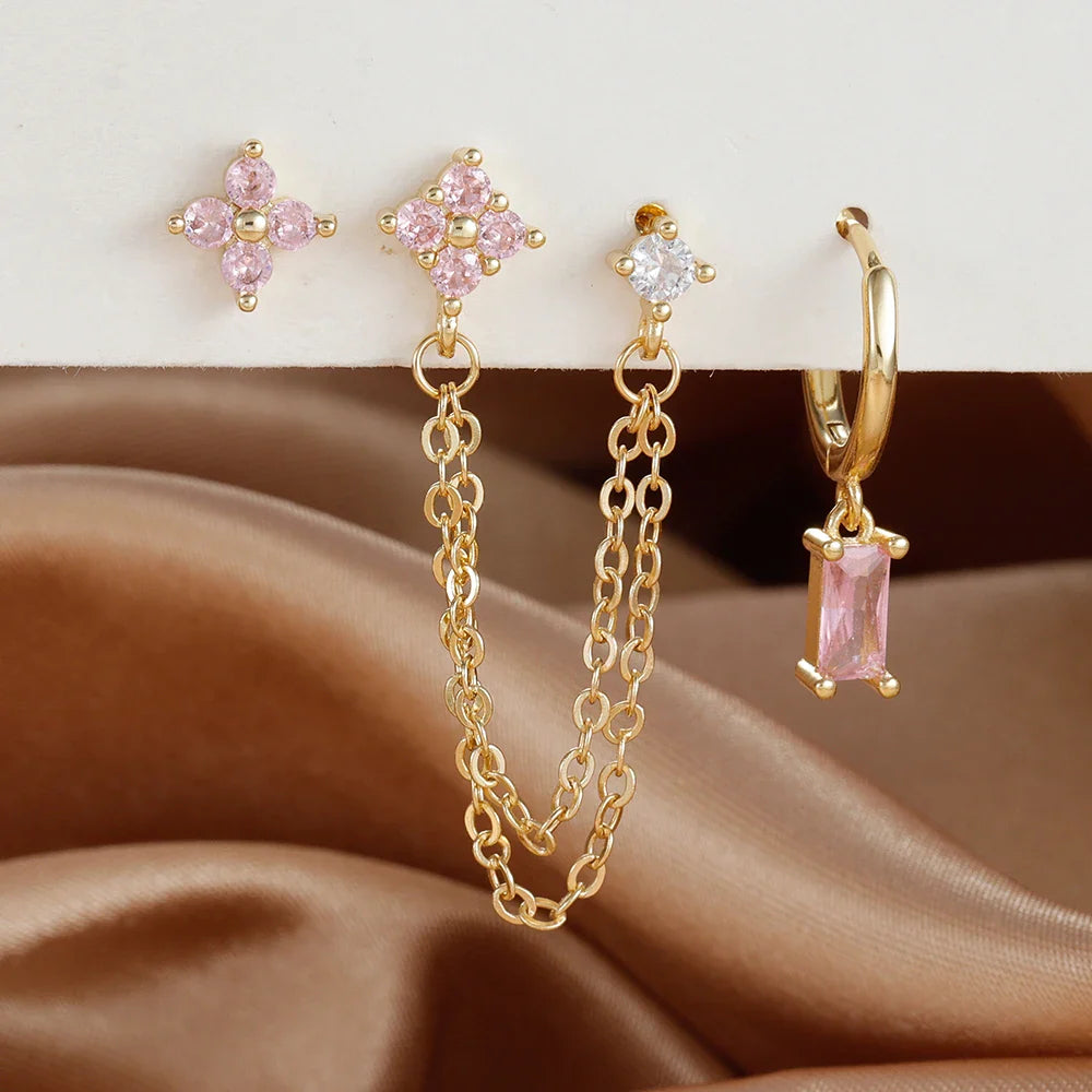 Celestial zodiac birthstone earring set in gold with gemstone accents and elegant chain detail