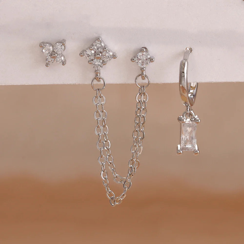 Celestial zodiac birthstone earring set in silver with gemstone accents and elegant chain detail