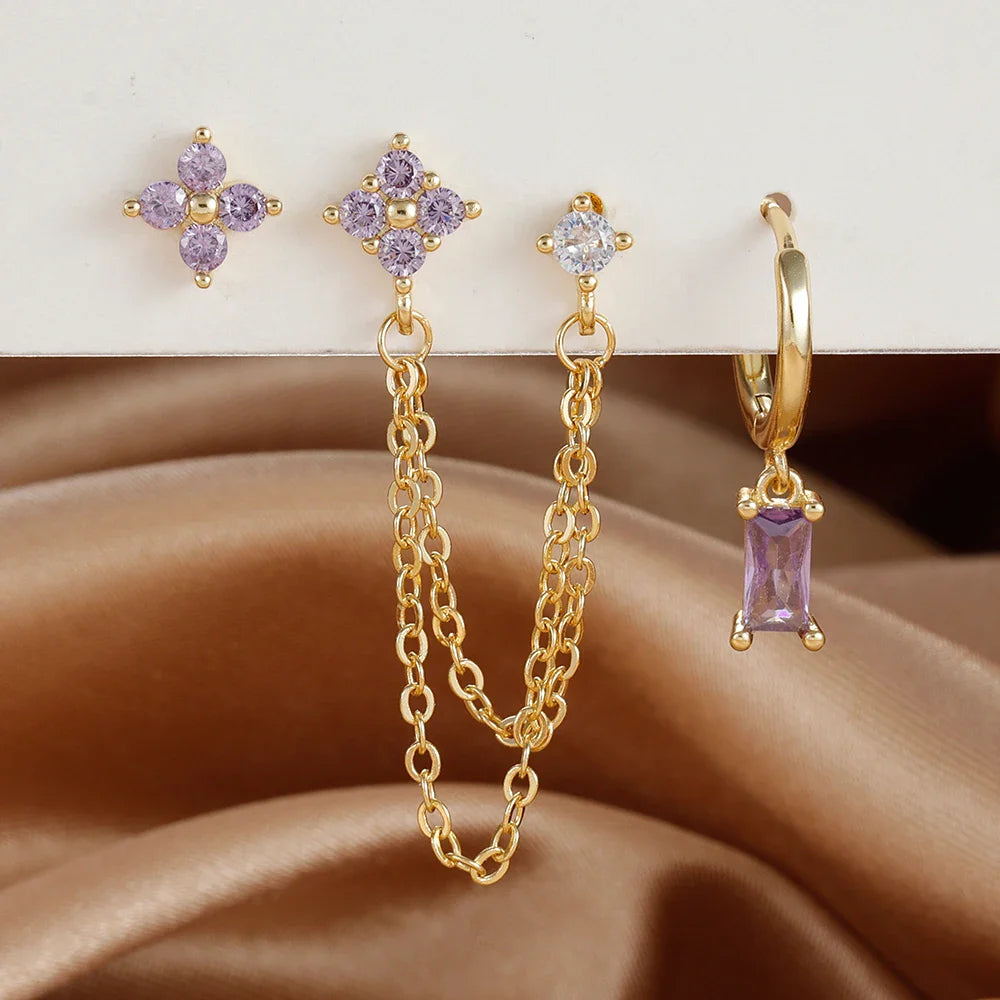 Celestial zodiac birthstone earring set in gold with gemstone accents and elegant chain detail
