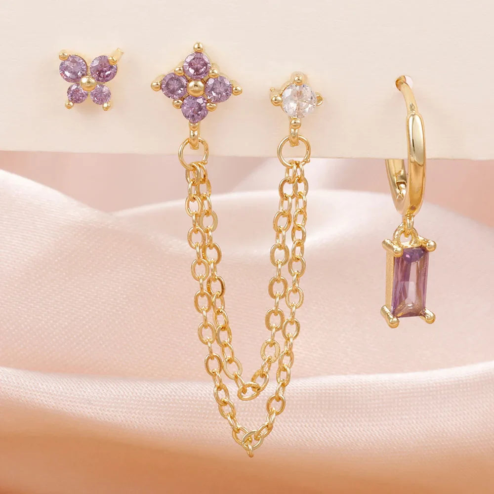 Celestial zodiac birthstone earring set in gold with gemstone accents and elegant chain detail