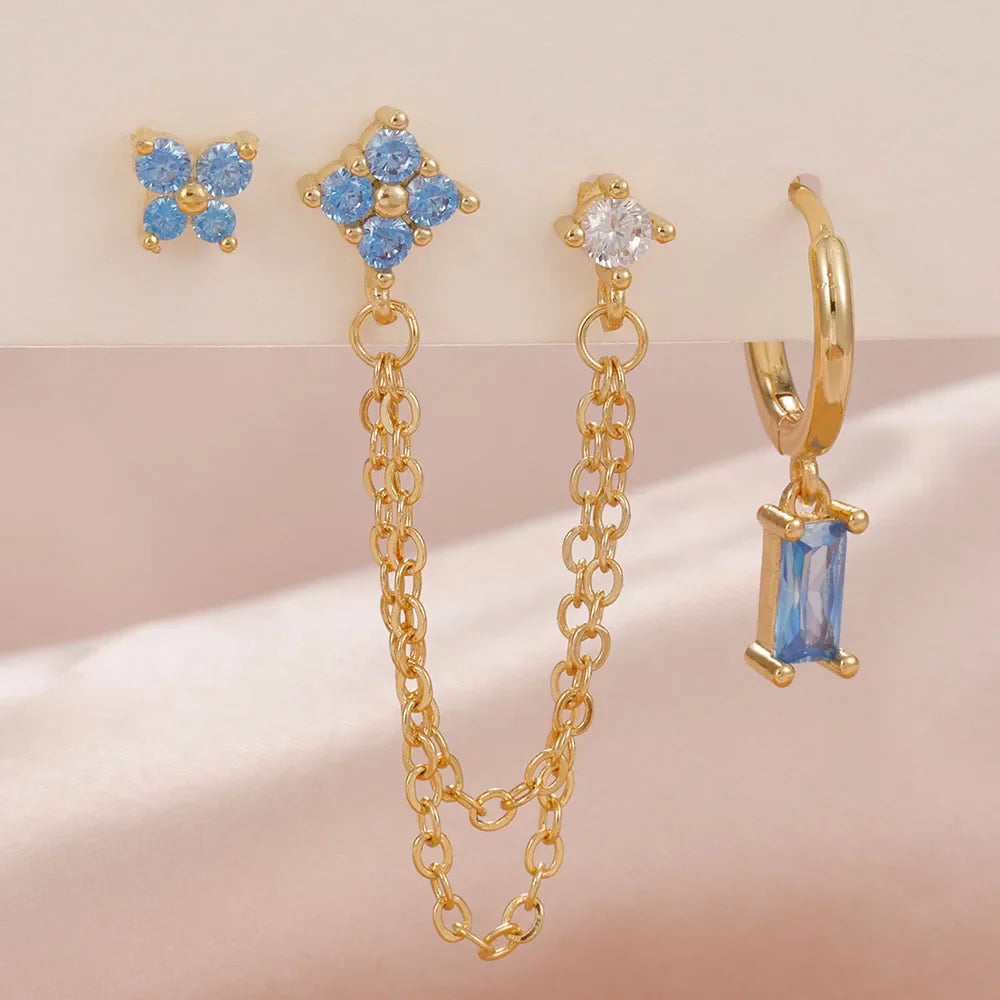 Celestial zodiac birthstone earring set in gold with gemstone accents and elegant chain detail