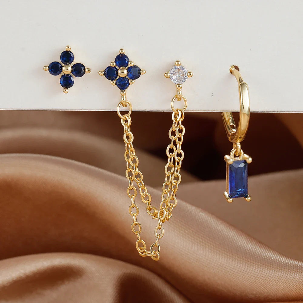 Celestial zodiac birthstone earring set in gold with gemstone accents and elegant chain detail