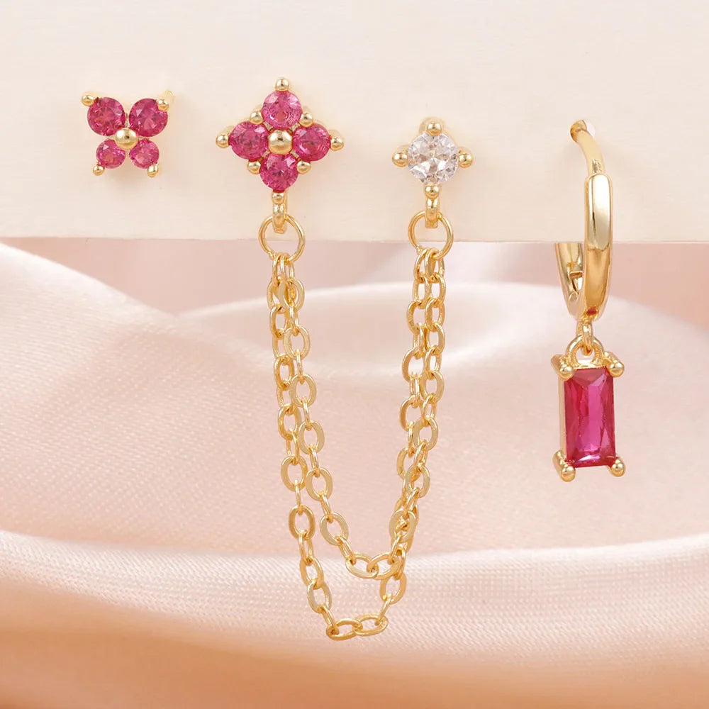 Celestial zodiac birthstone earring set in gold with gemstone accents and elegant chain detail