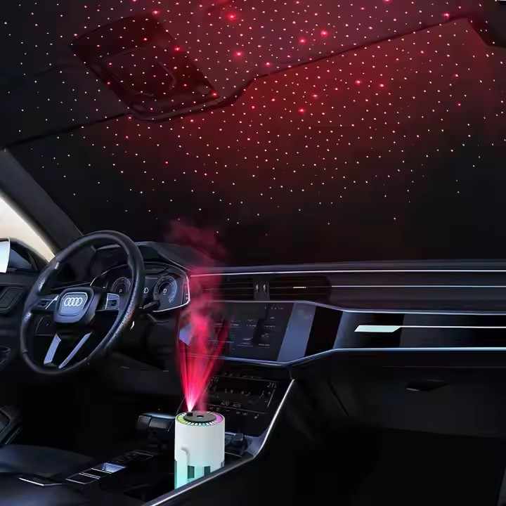 White starry night projector humidifier glowing with red mist effect