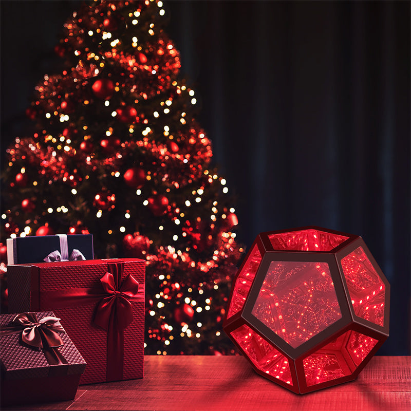 Red geometric light on a table with a decorated Christmas tree in the background
